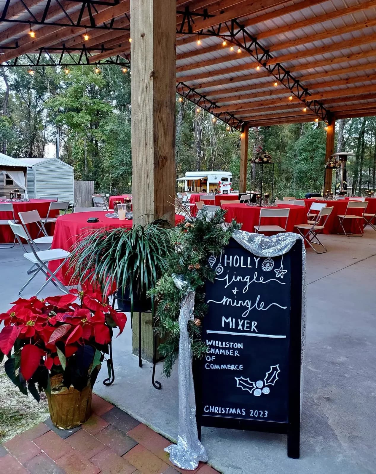 The pavilion decorated with poinsettias for the chamber's Holly Jingle Mingle