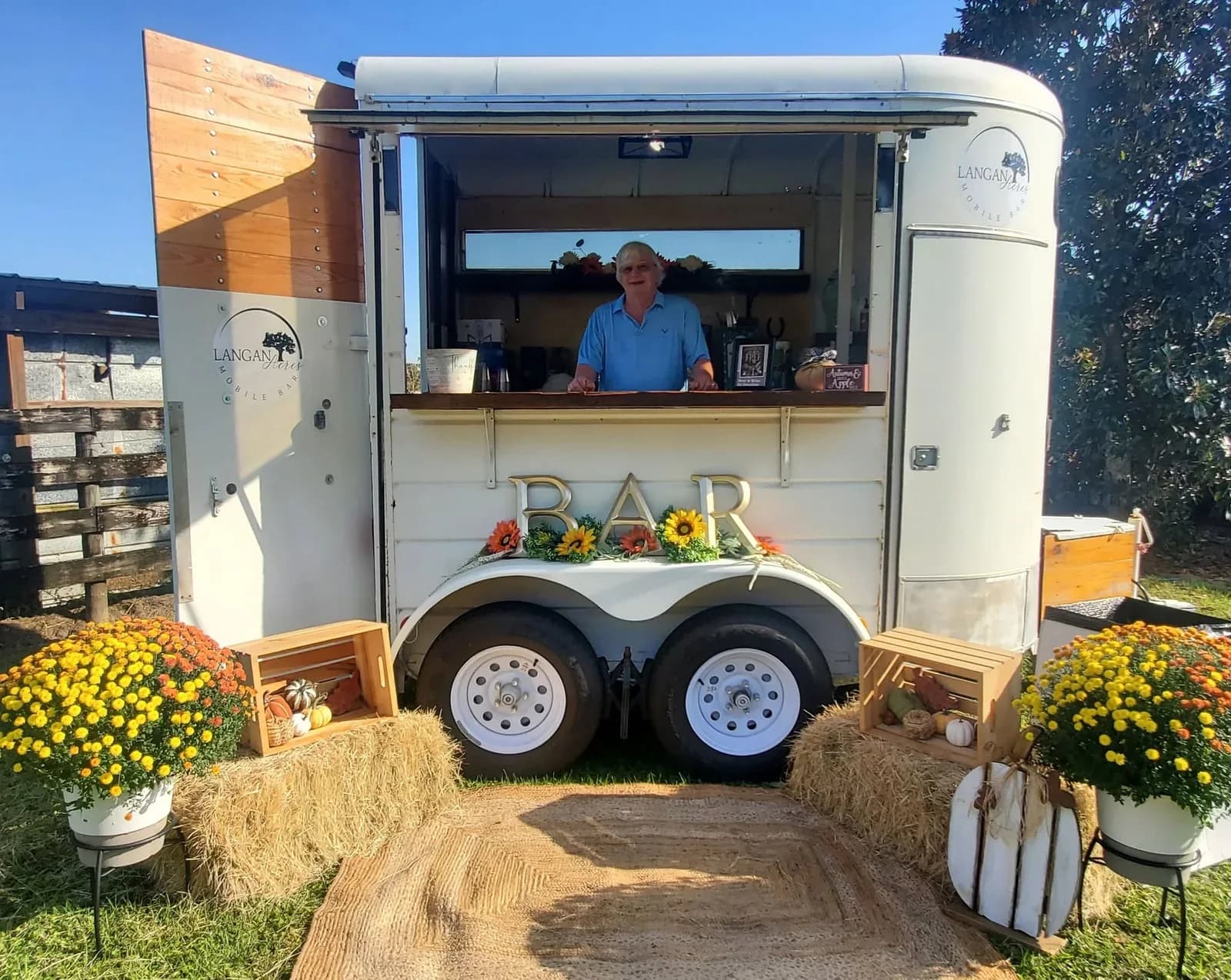Reese the mobile bar dressed for an event, the serving hatch open and flowers on the counter